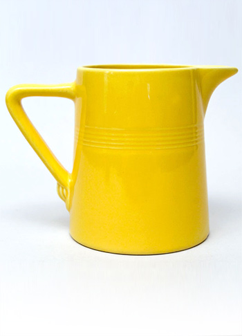 yellow vintage harlequin 22 ounce jug