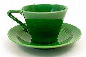 Vintage Harlequin Pottery Medium Green Cup and Saucer Set For Sale