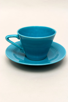 Vintage Harlequin Pottery Turquoise Cup and Saucer Set For Sale