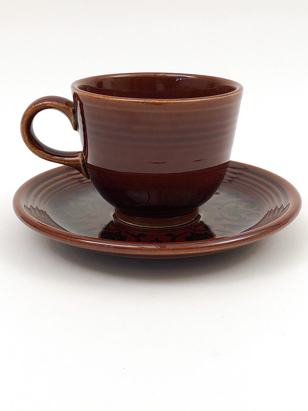 fiesta ironstone teacup and saucer set in sheffield amberstone dark brown