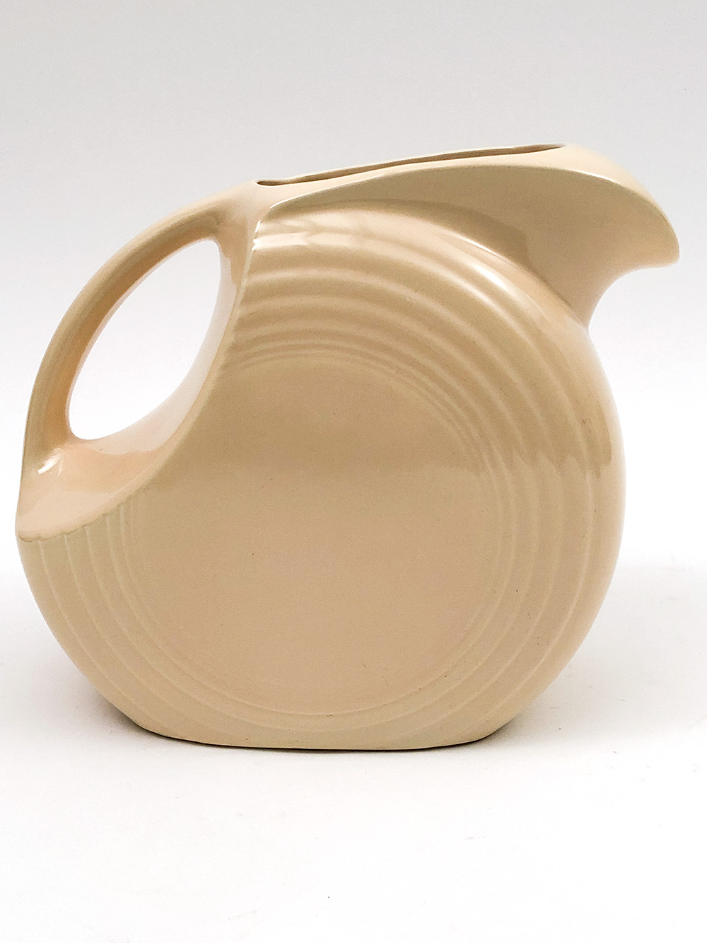ivory fiesta disc water pitcher