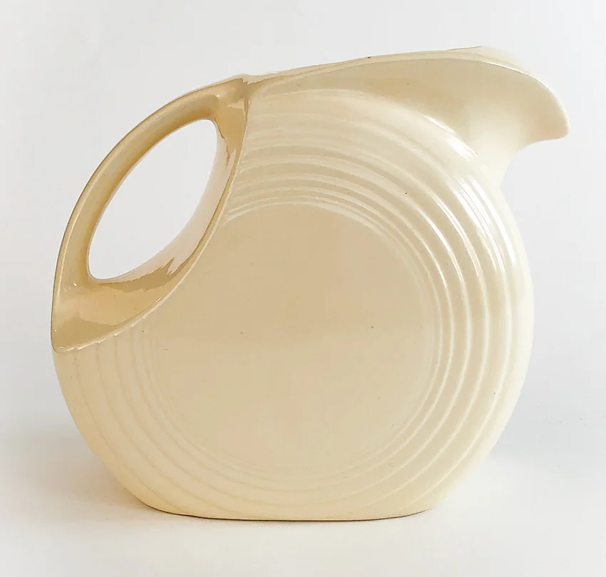ivory fiesta disc water pitcher