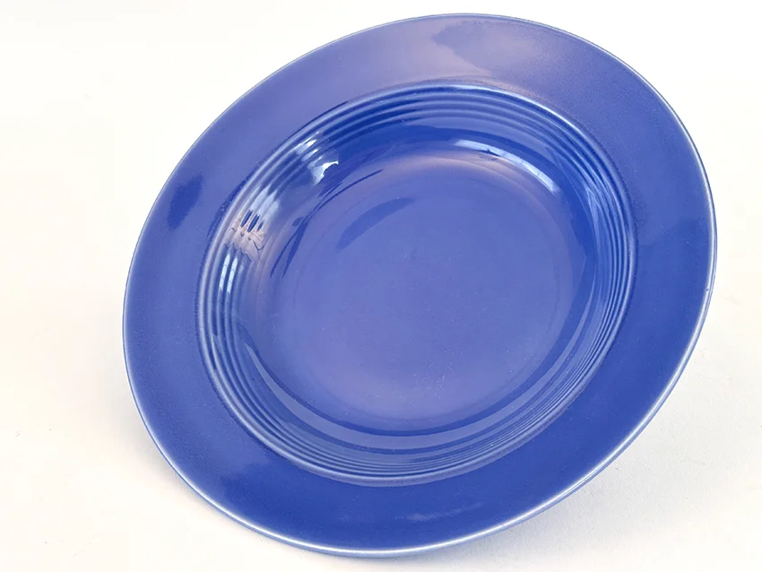 mauve blue vintage harlequin dinnerware deep plate made by Homer Laughlin for Woolworths