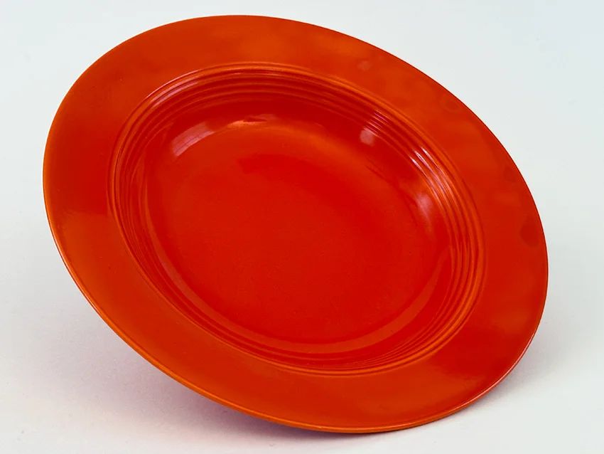 Red vintage harlequin dinnerware deep plate made by Homer Laughlin for Woolworths