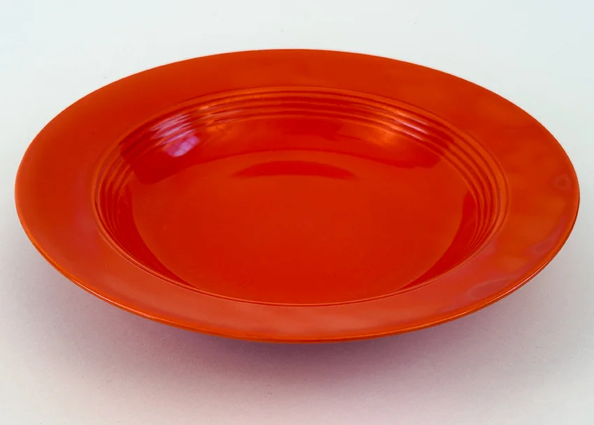 Red vintage harlequin dinnerware deep plate made by Homer Laughlin for Woolworths