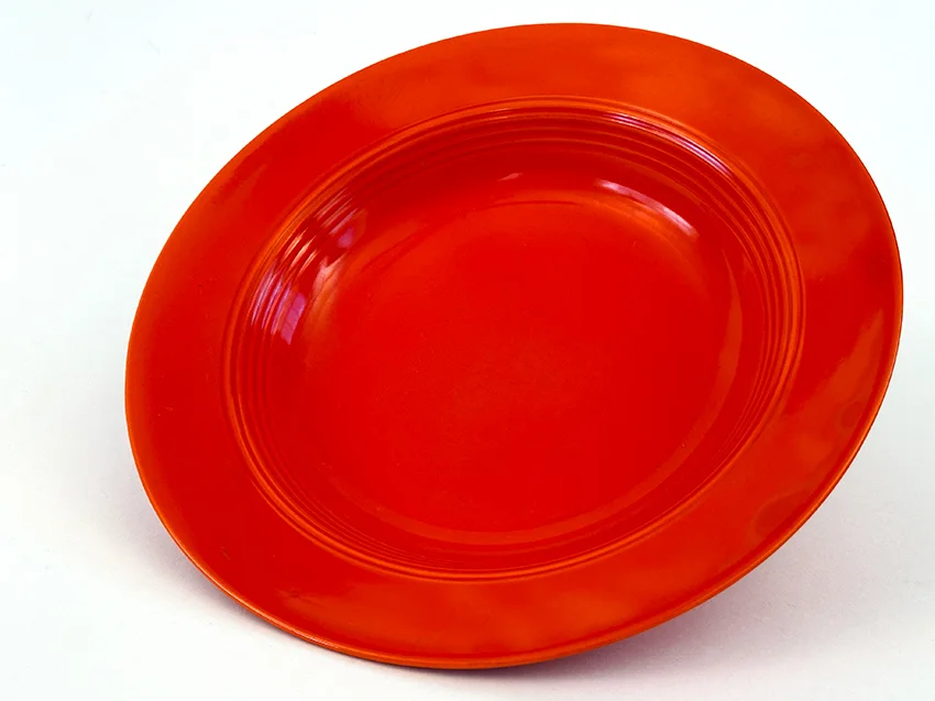 Red vintage harlequin dinnerware deep plate made by Homer Laughlin for Woolworths