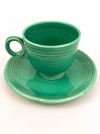 green vintage fiesta flat bottom teacup and saucer set from 1936