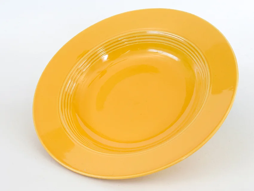 yellow vintage harlequin dinnerware deep plate made by Homer Laughlin for Woolworths