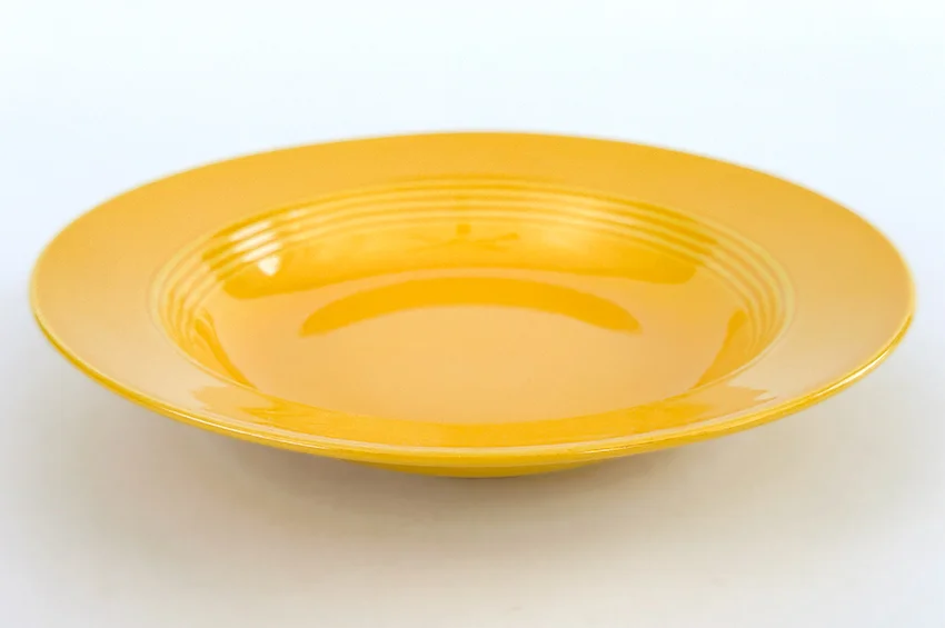 yellow vintage harlequin dinnerware deep plate made by Homer Laughlin for Woolworths