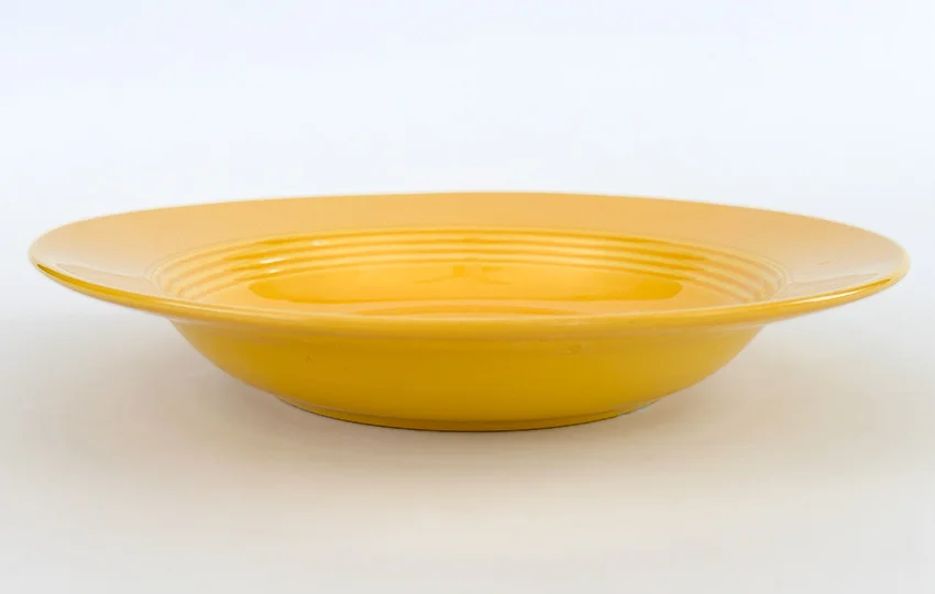 yellow vintage harlequin dinnerware deep plate made by Homer Laughlin for Woolworths