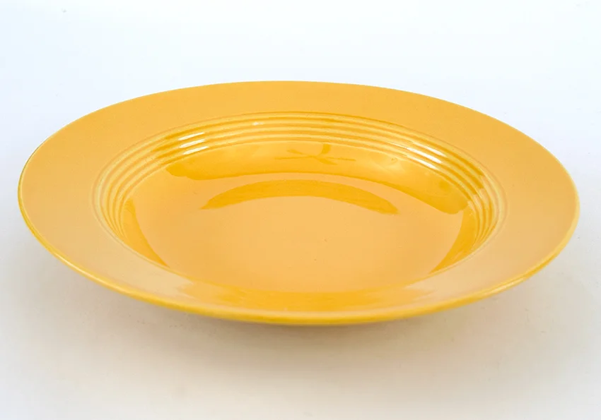 yellow vintage harlequin dinnerware deep plate made by Homer Laughlin for Woolworths