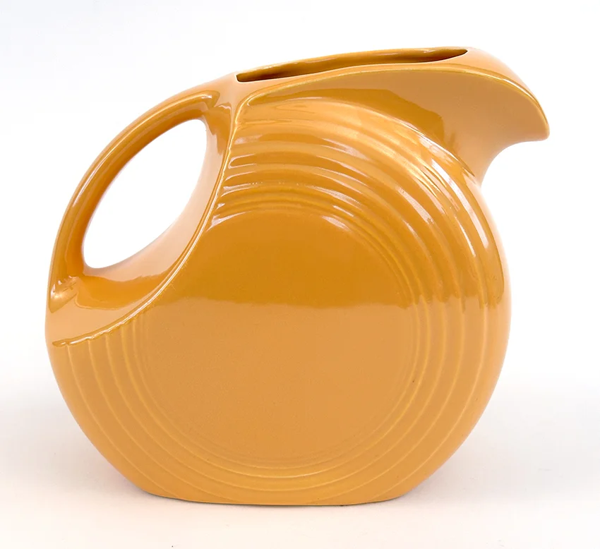 yellow vintage fiestaware disk water pitcher for sale made from1938-1959