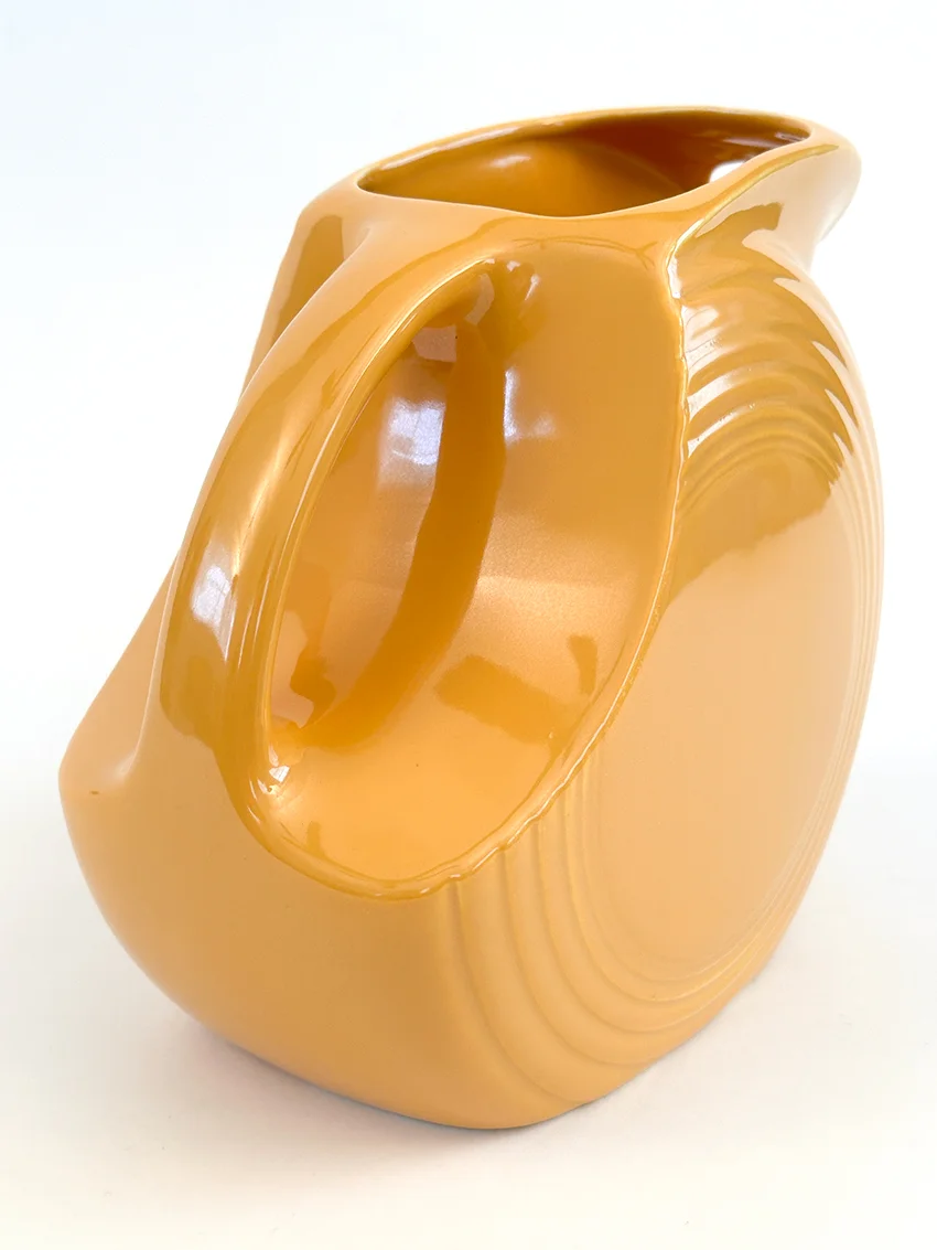 yellow vintage fiestaware disk water pitcher for sale made from1938-1959